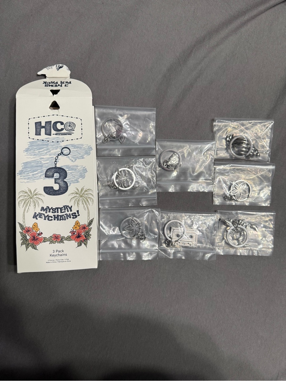 Hollister White & Blue Mystery Keychain 3-Pack with Floral Artwork